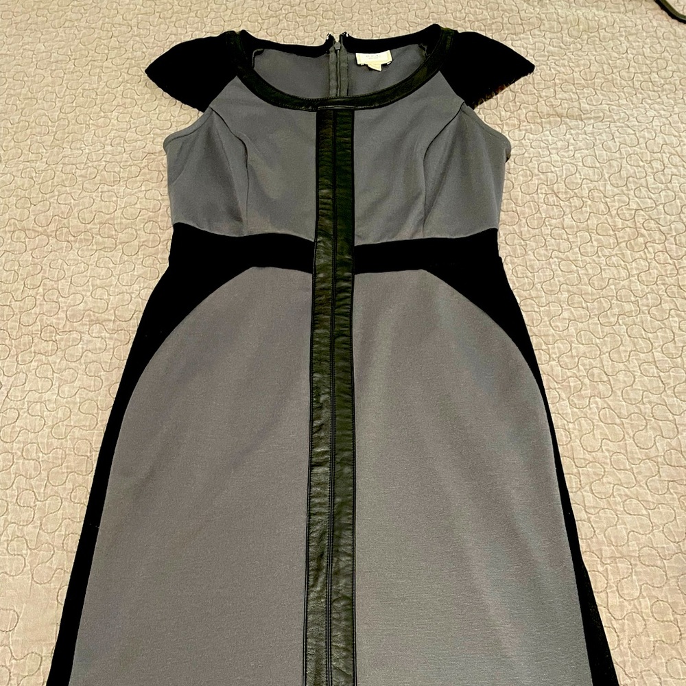 Cap sleeve shift dress stylish leather detail.